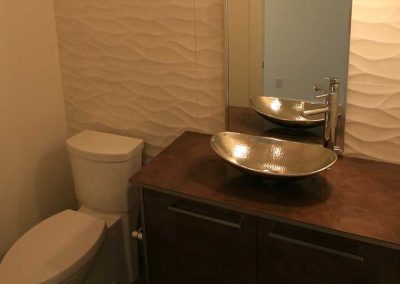 LoneWolf Homes Rayburn powder room with floor to ceiling tile